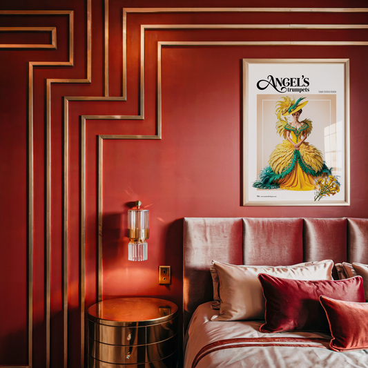 Decorative interior with a red wall, framed poster, and bed with pillows.