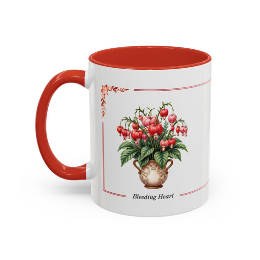 White mug with red interior and handle, featuring a design of bleeding heart flowers on a white background.