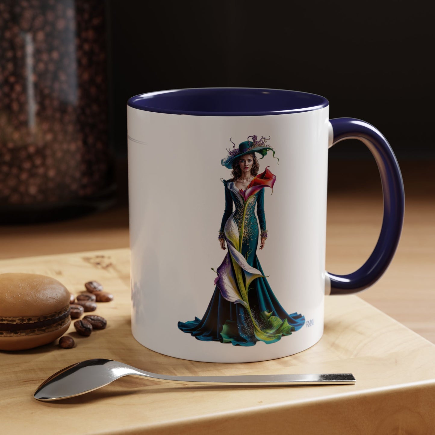 Mug with a colorful dress design on a wooden surface with coffee beans and a spoon.