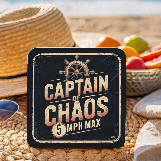 Coaster with "Captain of Chaos" text and design on a woven surface with fruit in the background