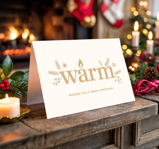 Christmas card with the word "Warm" on a festive background with candles and stockings.
