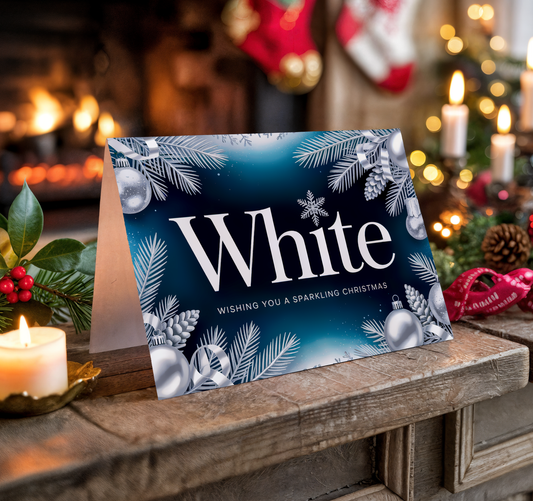 Christmas card with "White" text on a festive background with candles and decorations.