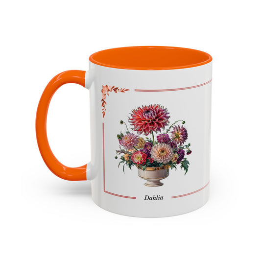 Mug with orange interior and handle, featuring a floral design and "Dahlia" text on a white background.