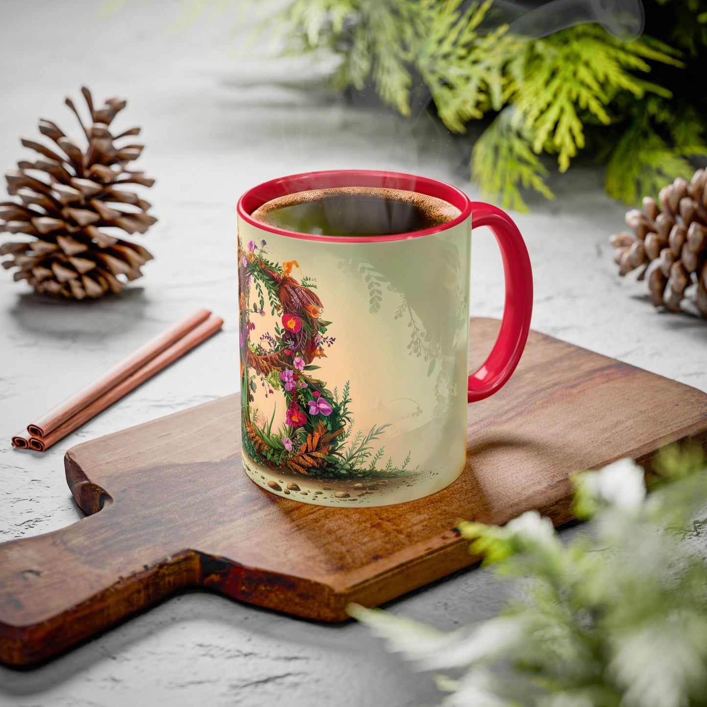 Mug with a nature-themed design on a wooden board with pine cones and cinnamon sticks.