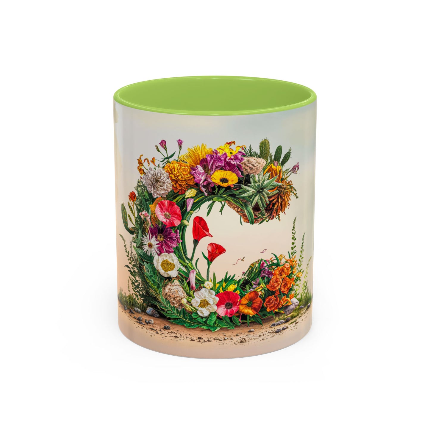 Mug with floral design and green interior on a white background