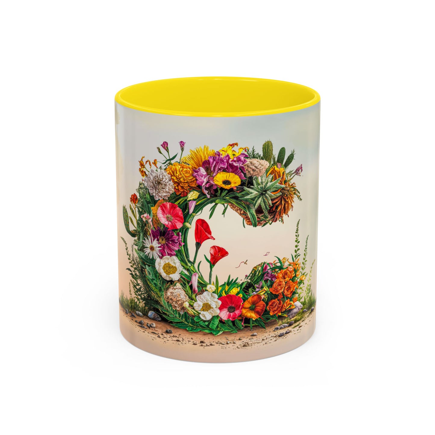Mug with floral design and yellow interior on a white background