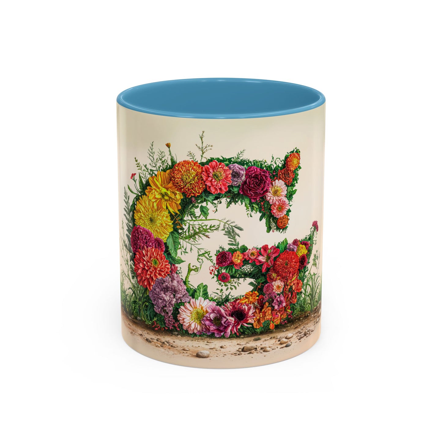 Mug with floral design and blue interior on a white background