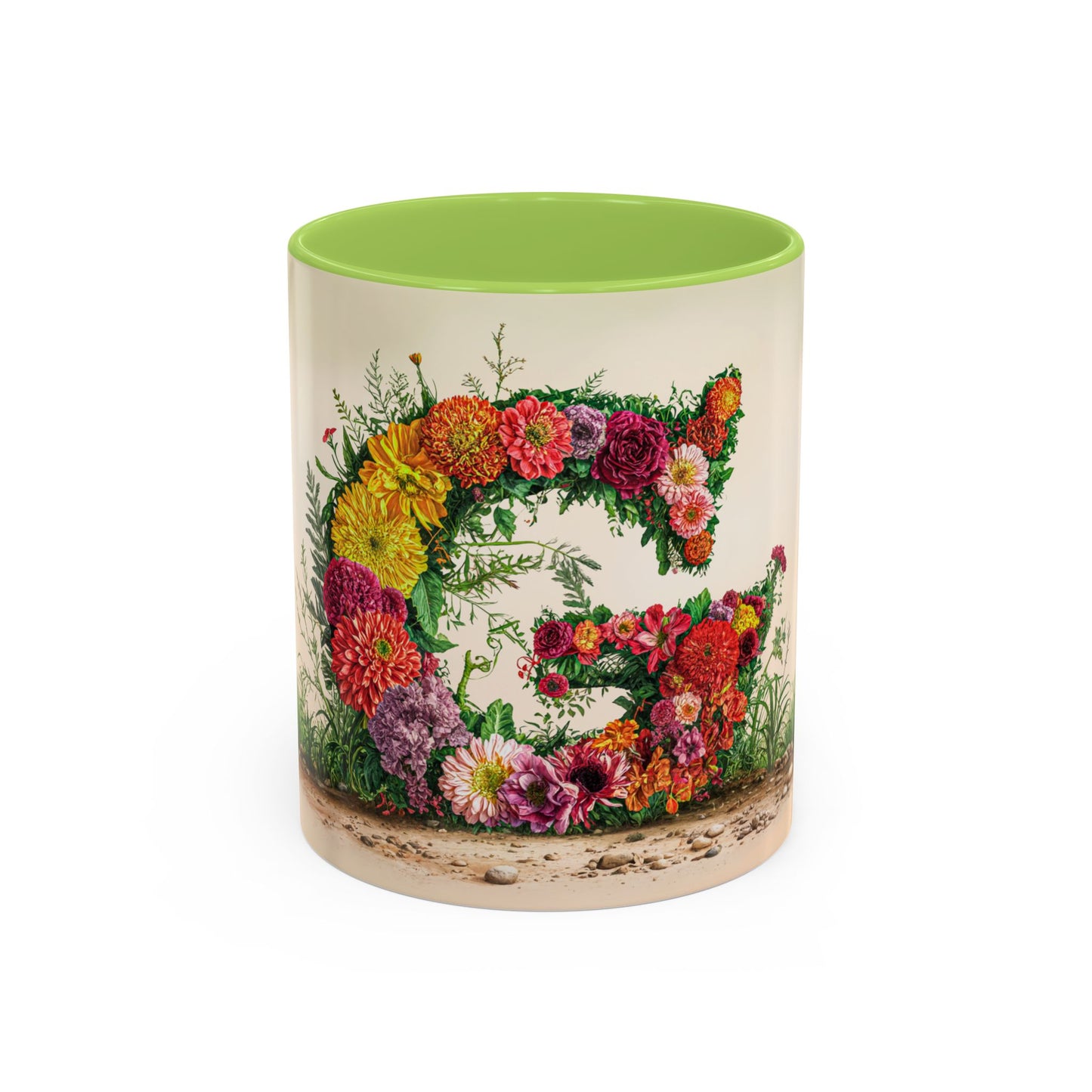 Mug with floral design and green interior on a white background