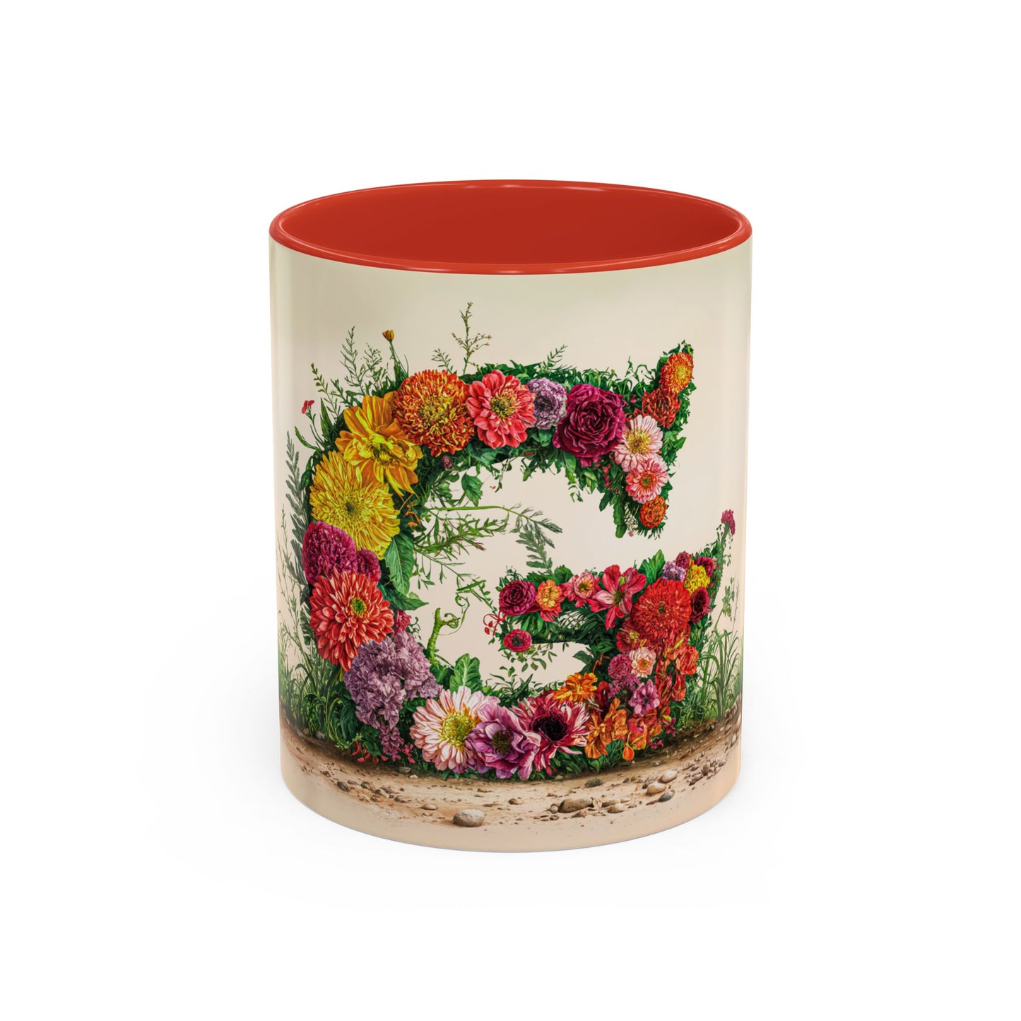 Mug with floral design and red interior on a white background