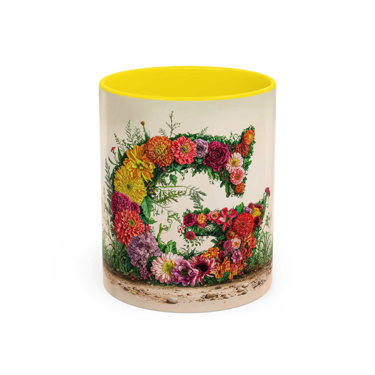 Mug with floral design and yellow interior on a white background