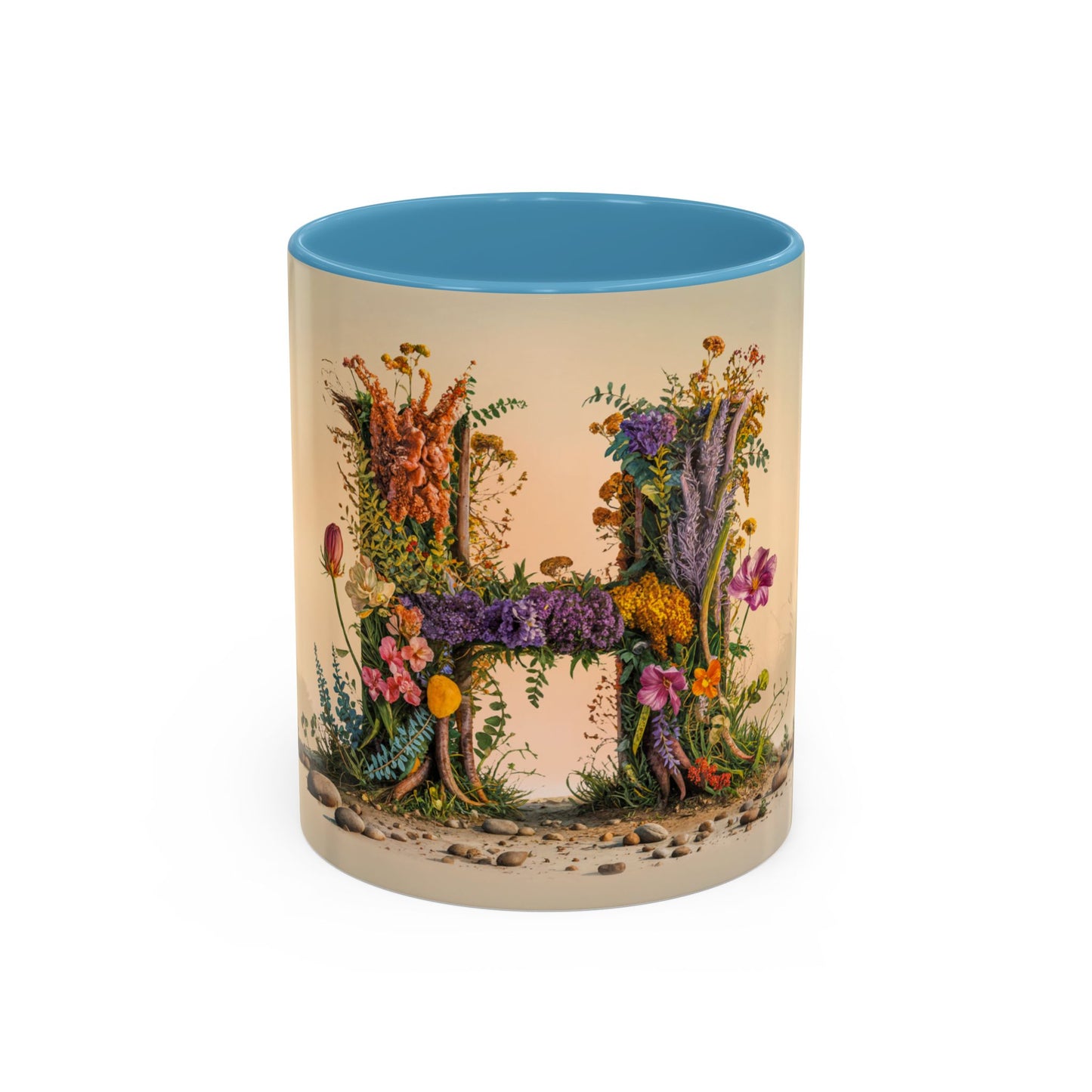 Mug with floral design spelling 'H' on a beige background