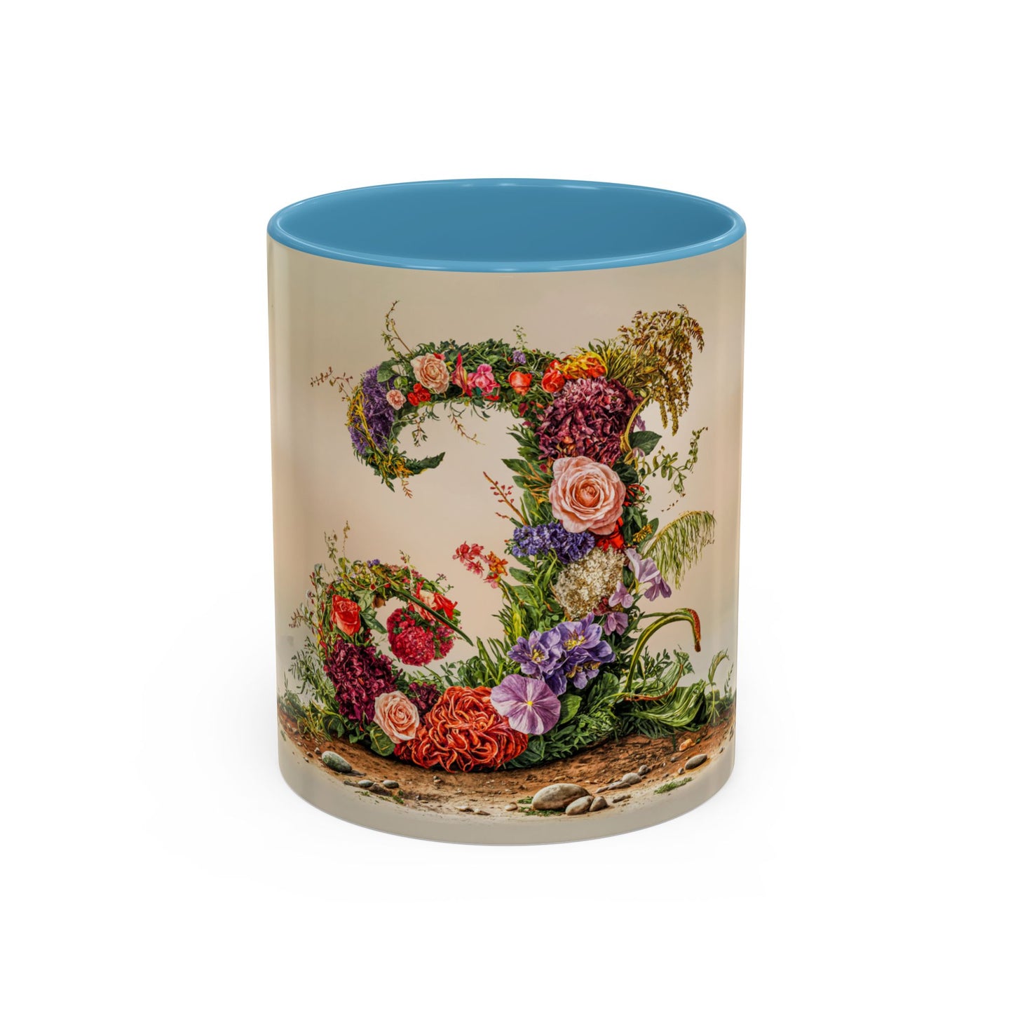 Mug with floral design and blue interior on a white background