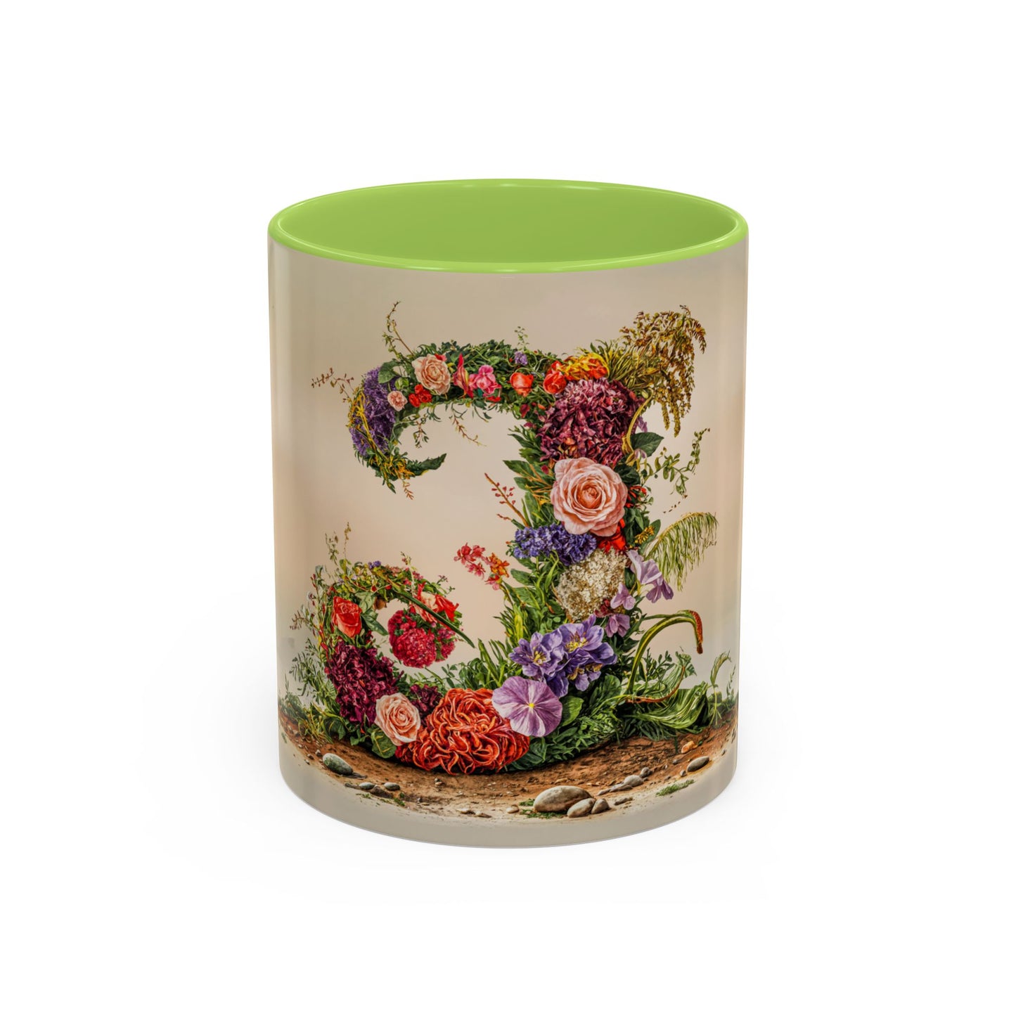Mug with floral design and green interior on a white background
