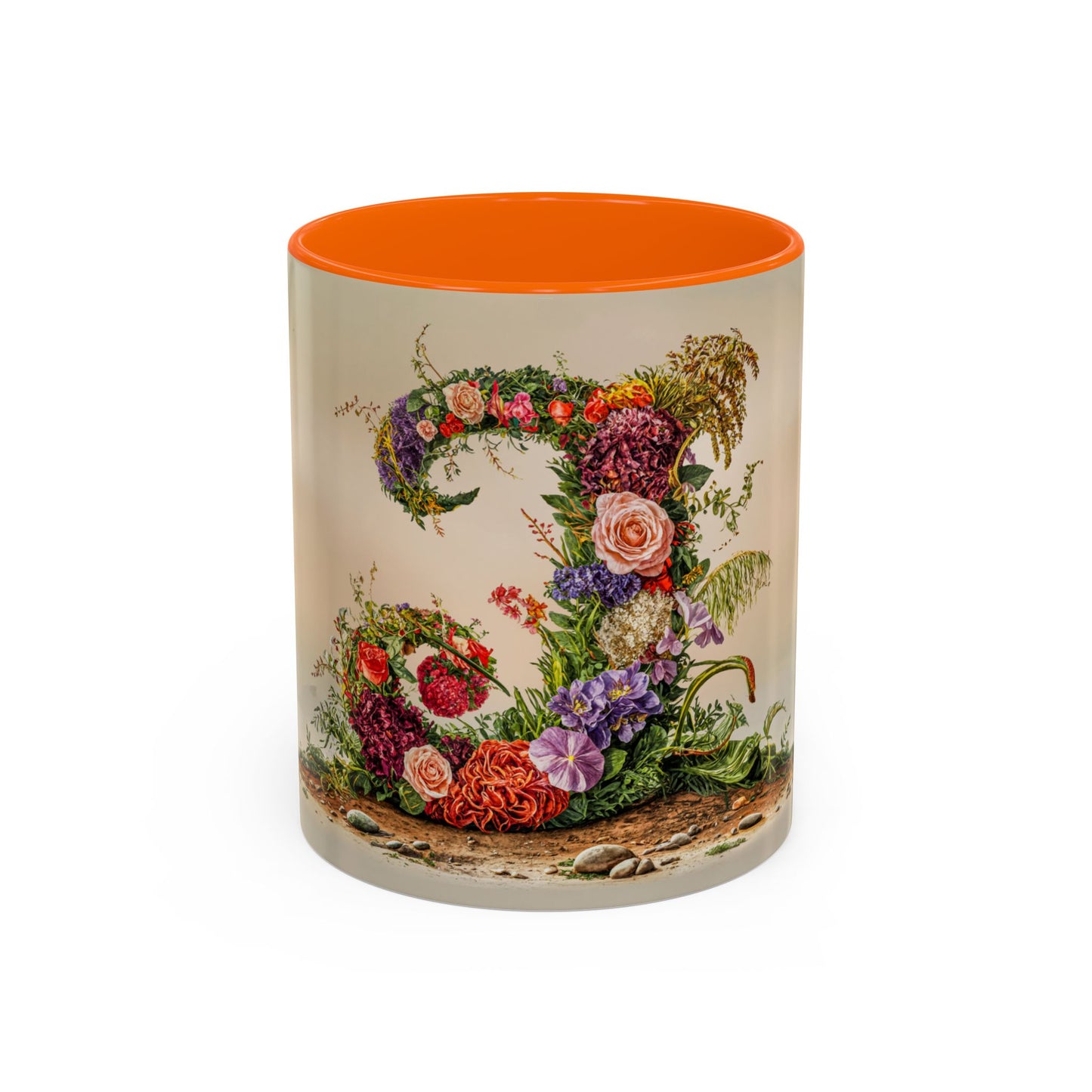 Mug with floral design and orange interior on a white background