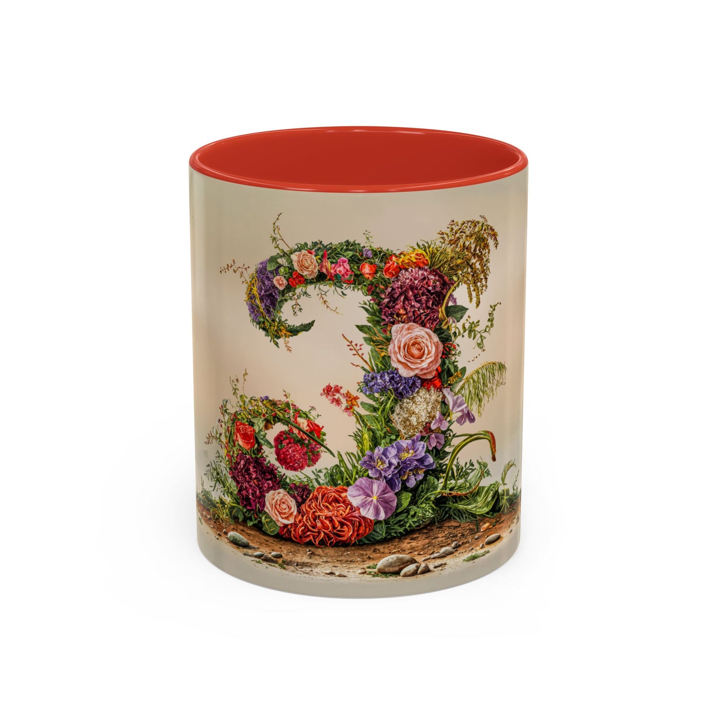 Mug with floral design and red interior on a white background