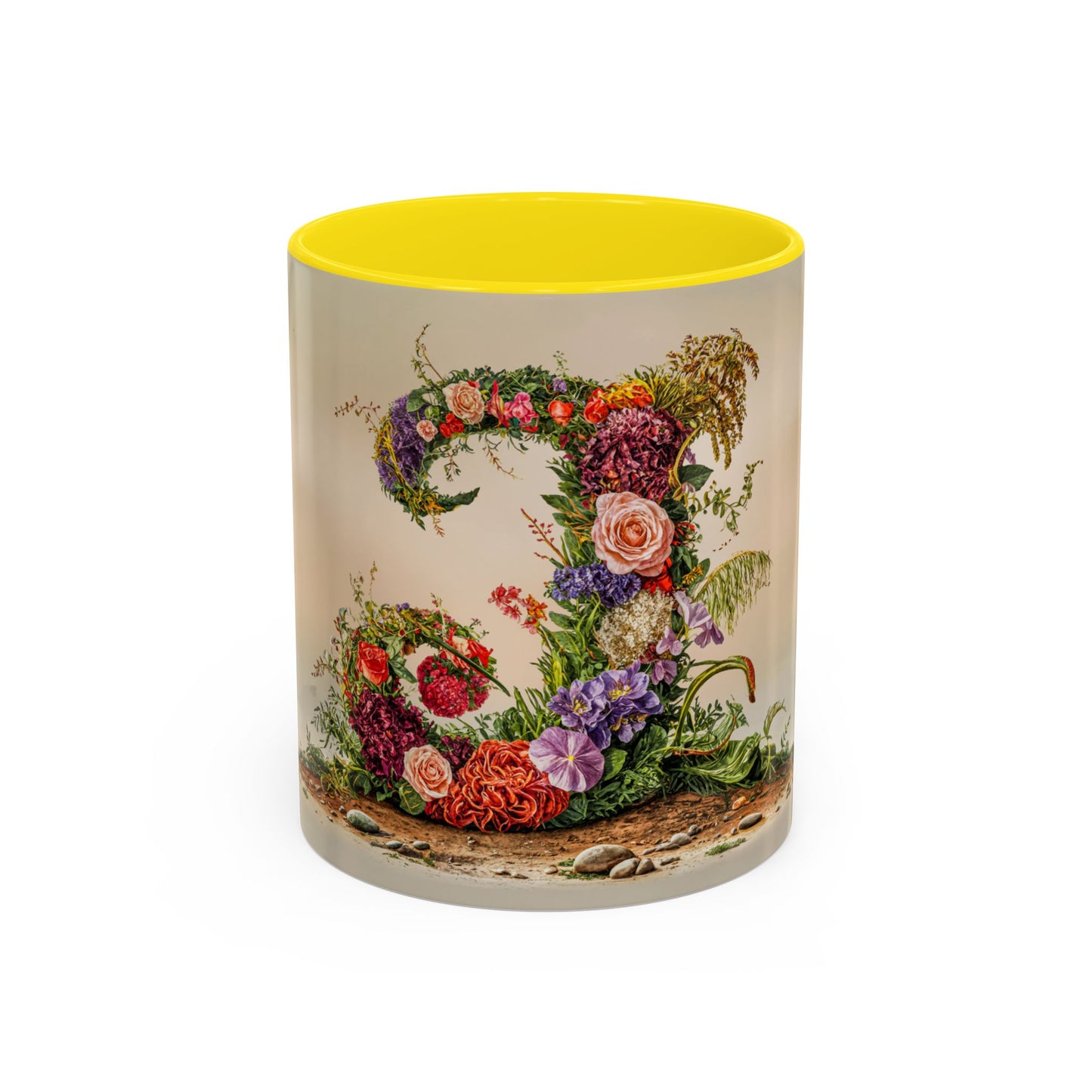 Mug with floral design and yellow interior on a white background