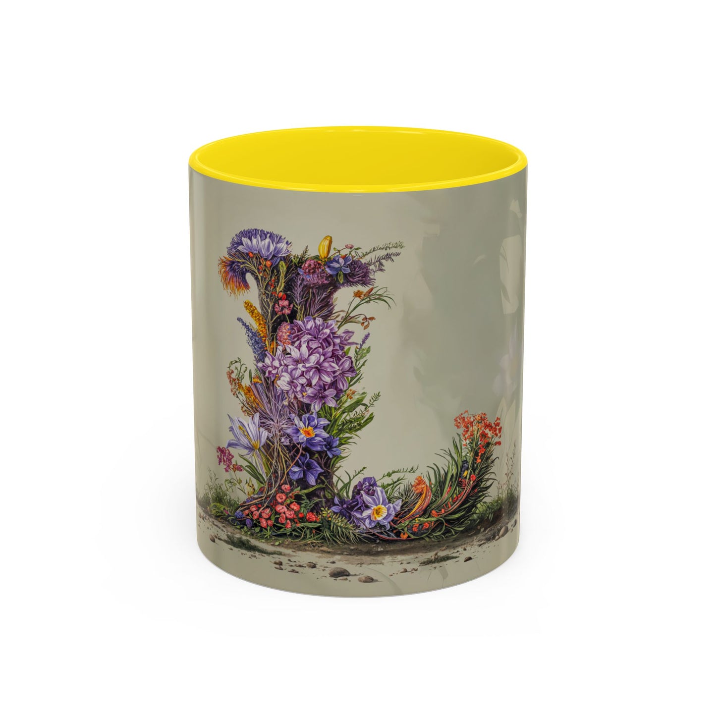 Mug with floral design and yellow interior on a white background