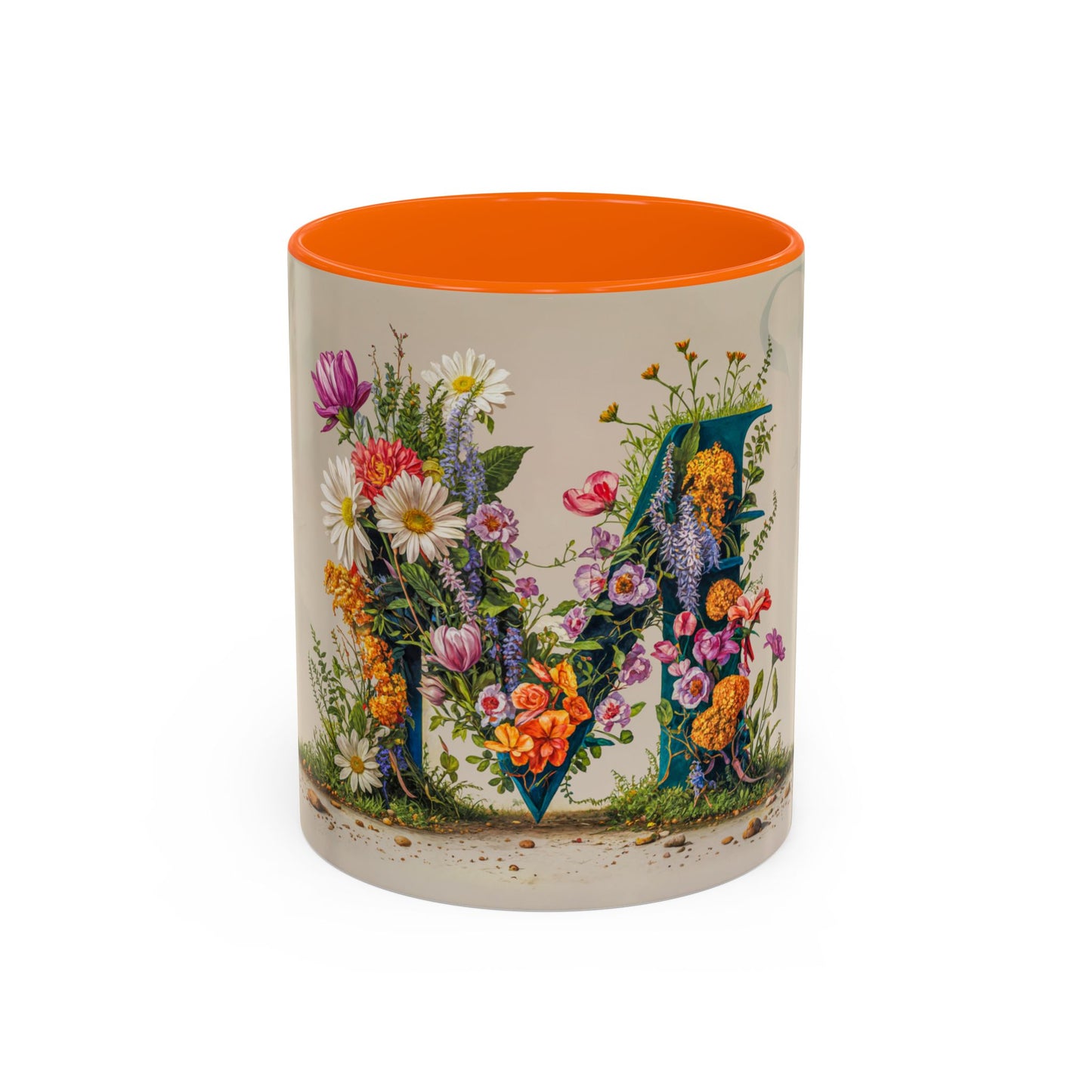 Mug with floral design and orange interior on a white background