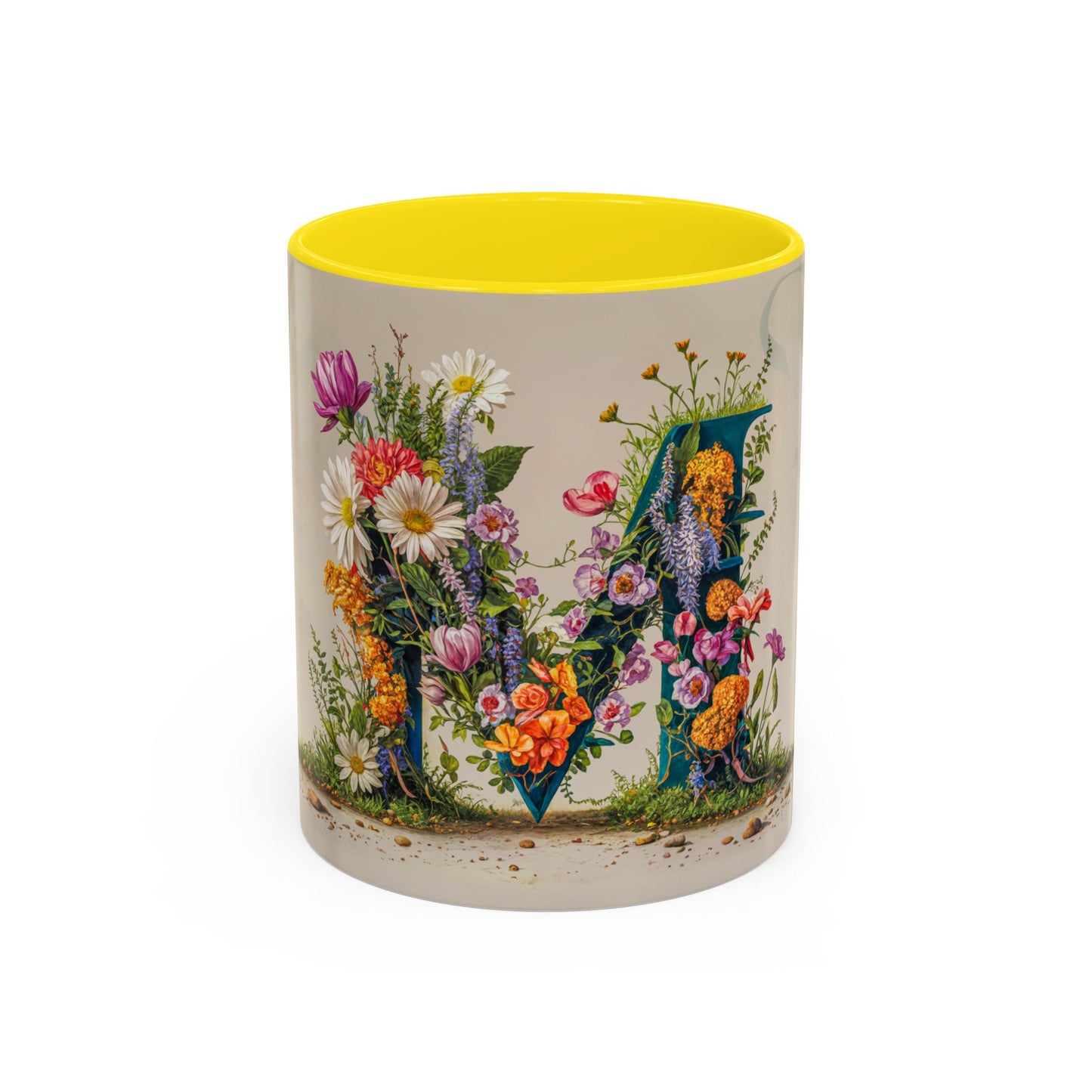 Mug with floral design and yellow interior on a white background