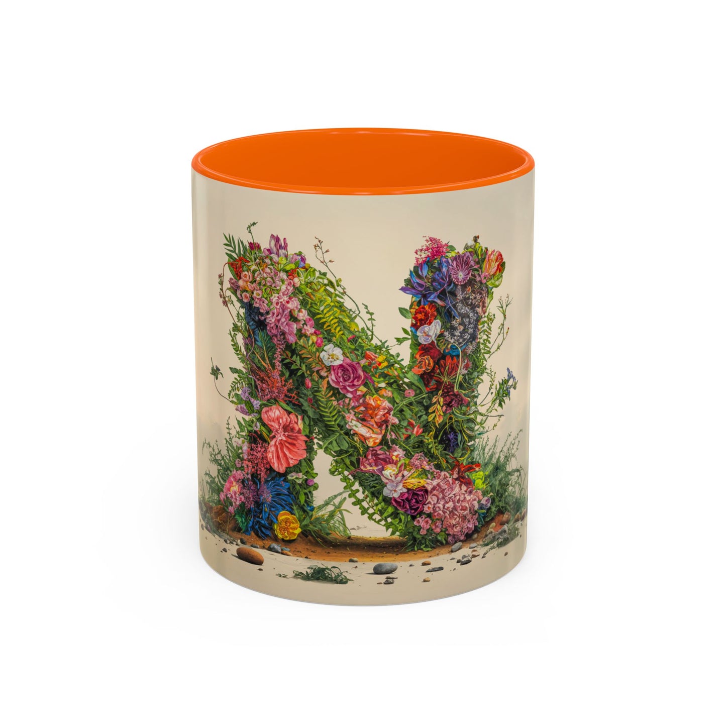 Mug with floral design and orange interior on a white background