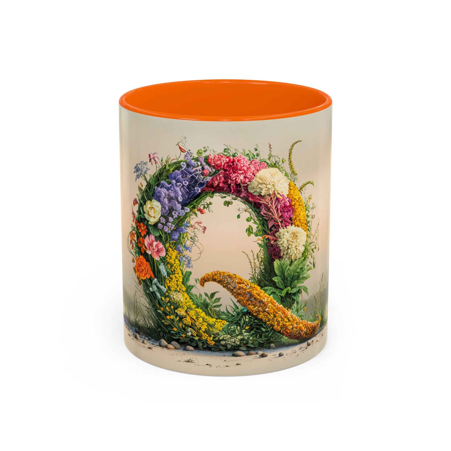 Ceramic mug with floral design and orange interior on a white background