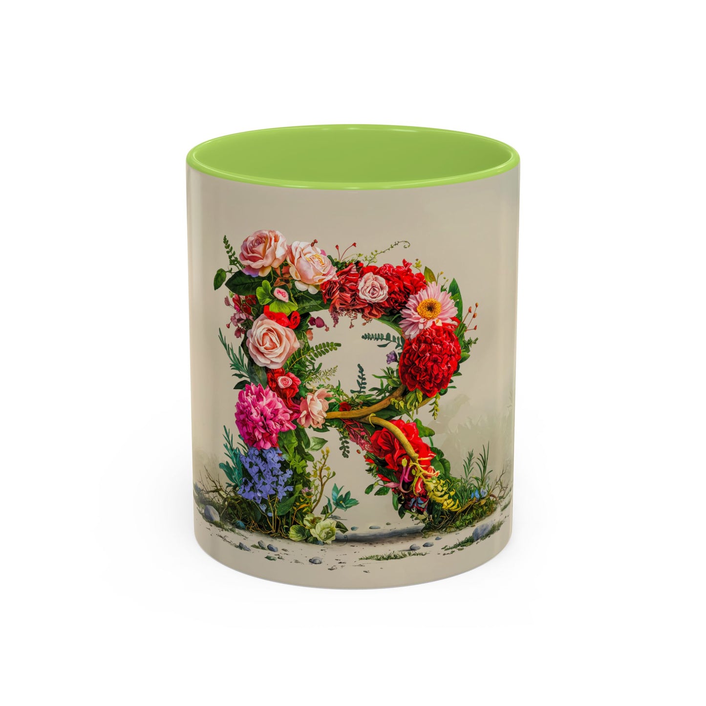 Mug with floral design and green interior on a white background