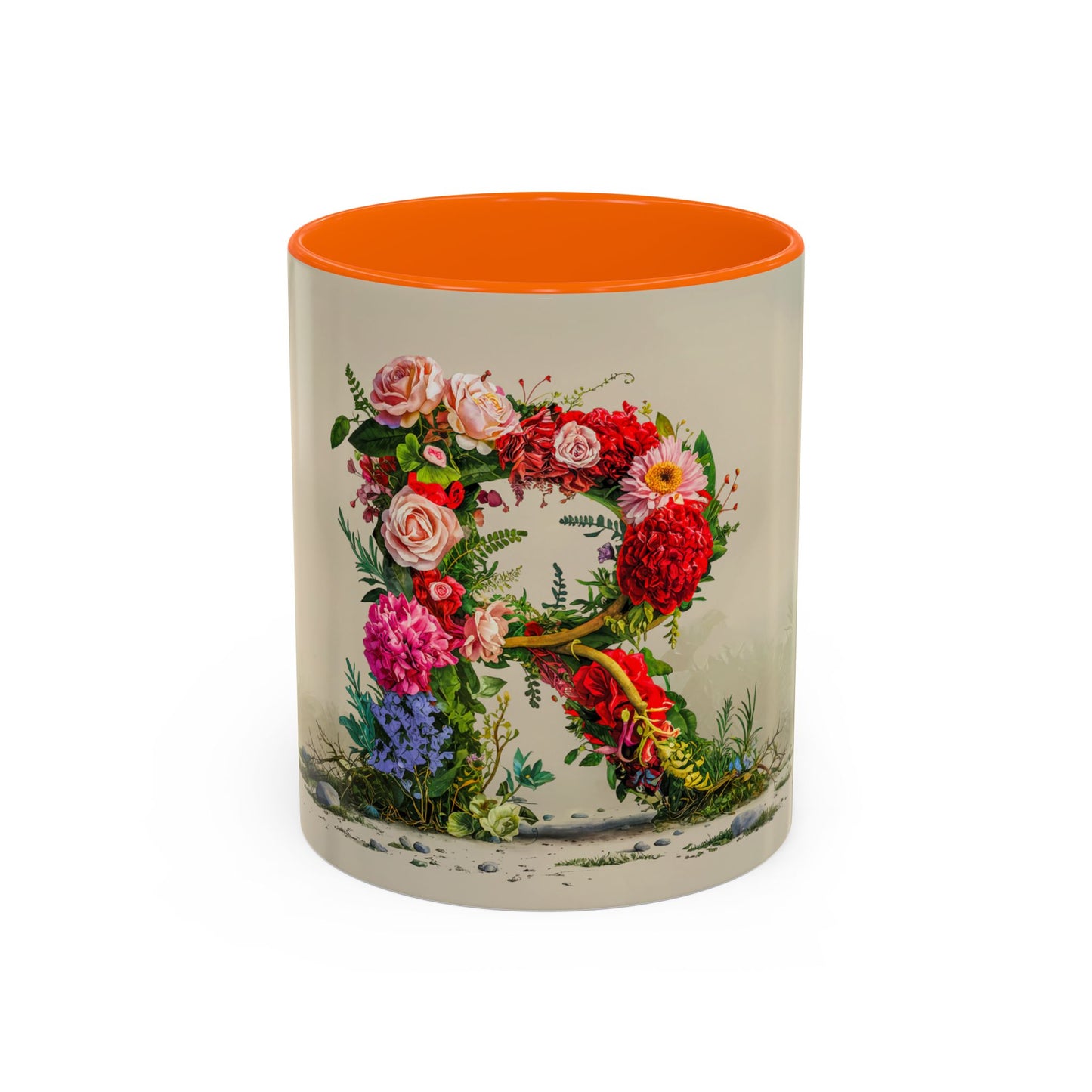 Mug with floral design and orange interior on a white background