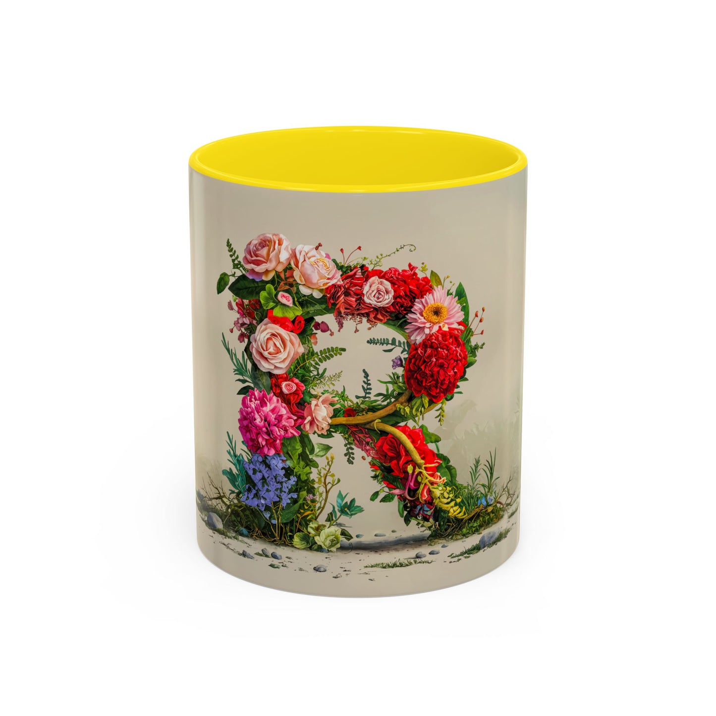 Mug with floral design and yellow interior on a white background