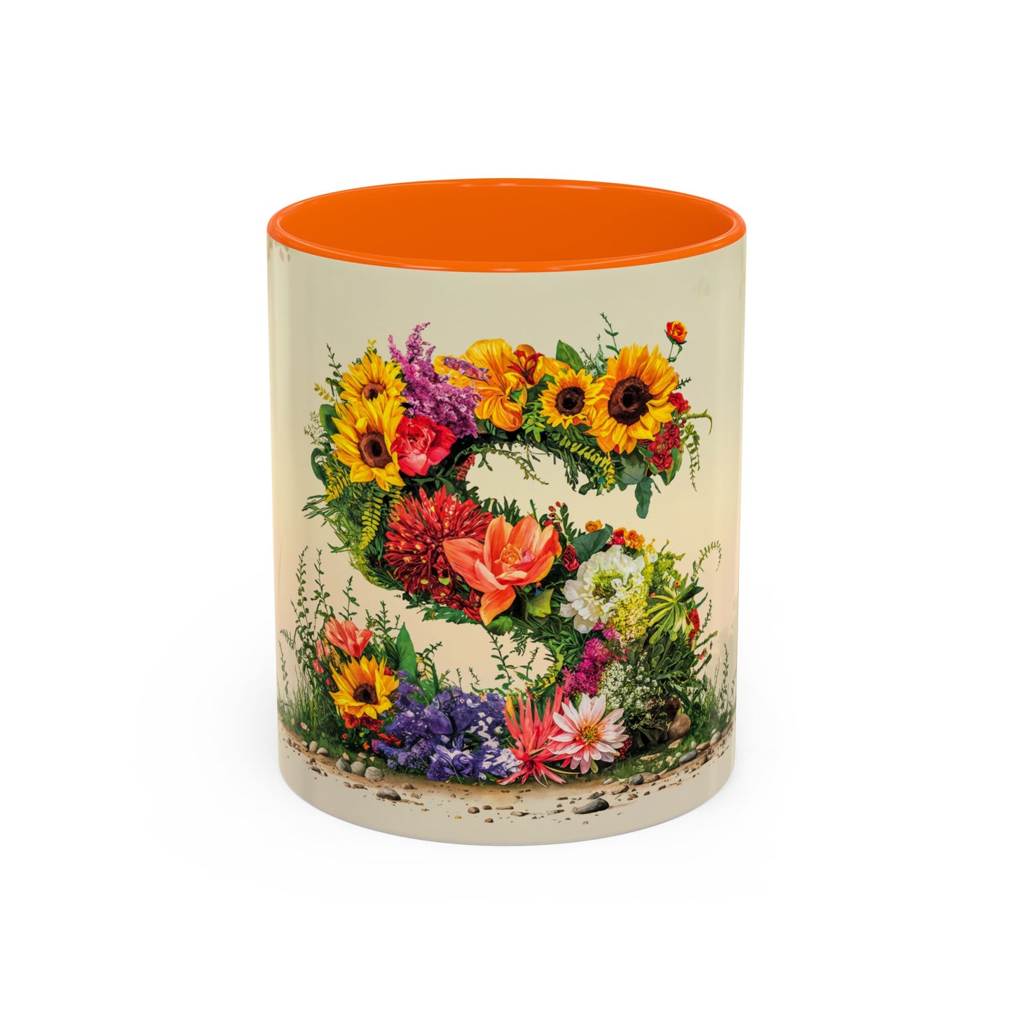 Mug with floral design and orange interior on a white background