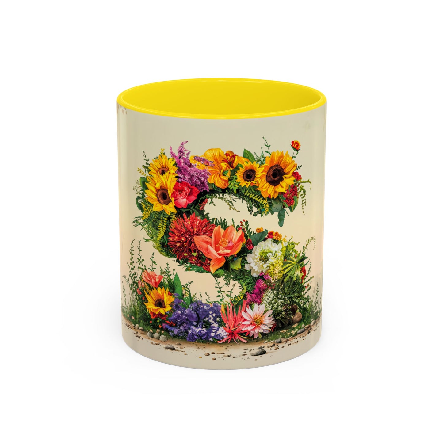 Mug with floral design and yellow interior on a white background