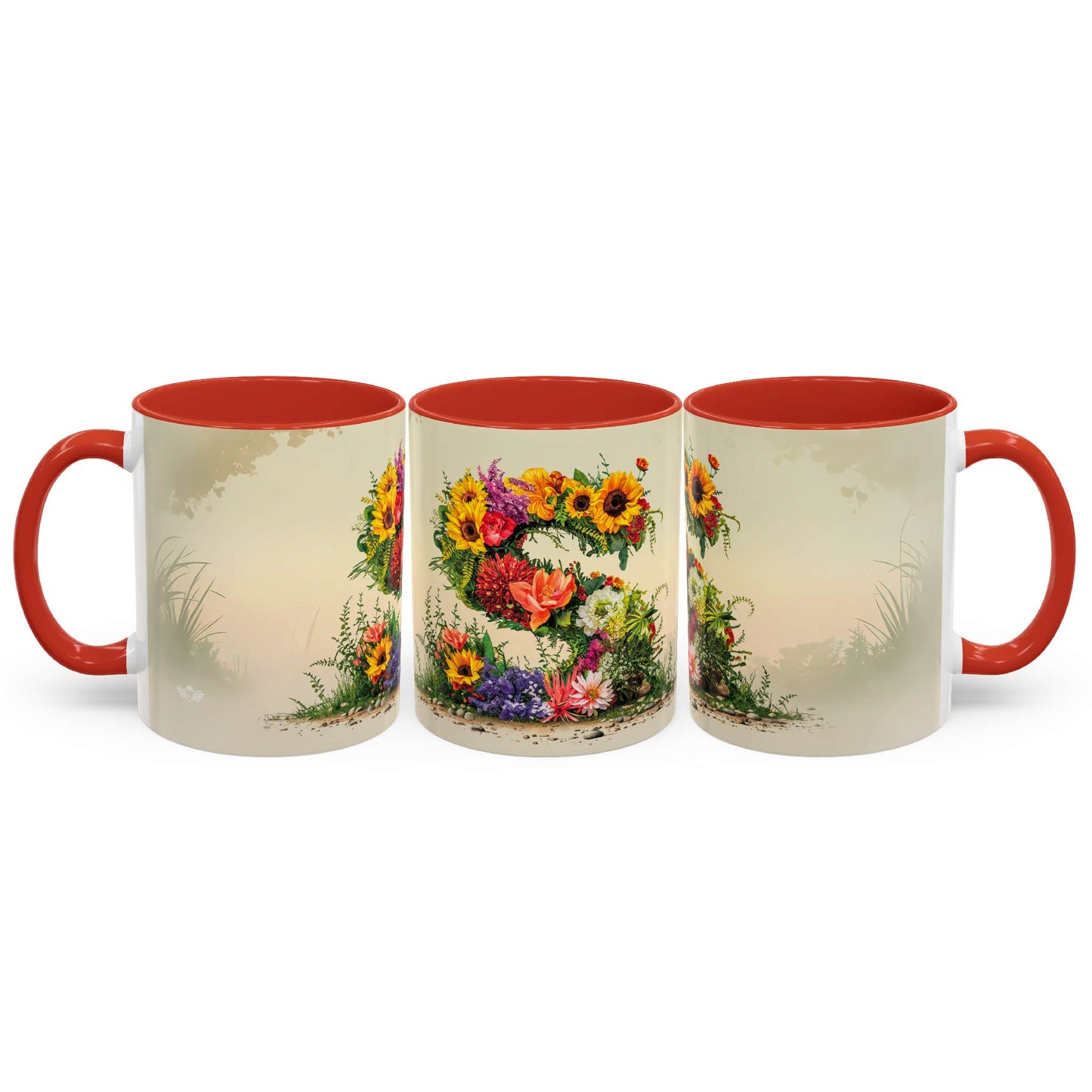 Three ceramic mugs with floral designs and red handles on a white background
