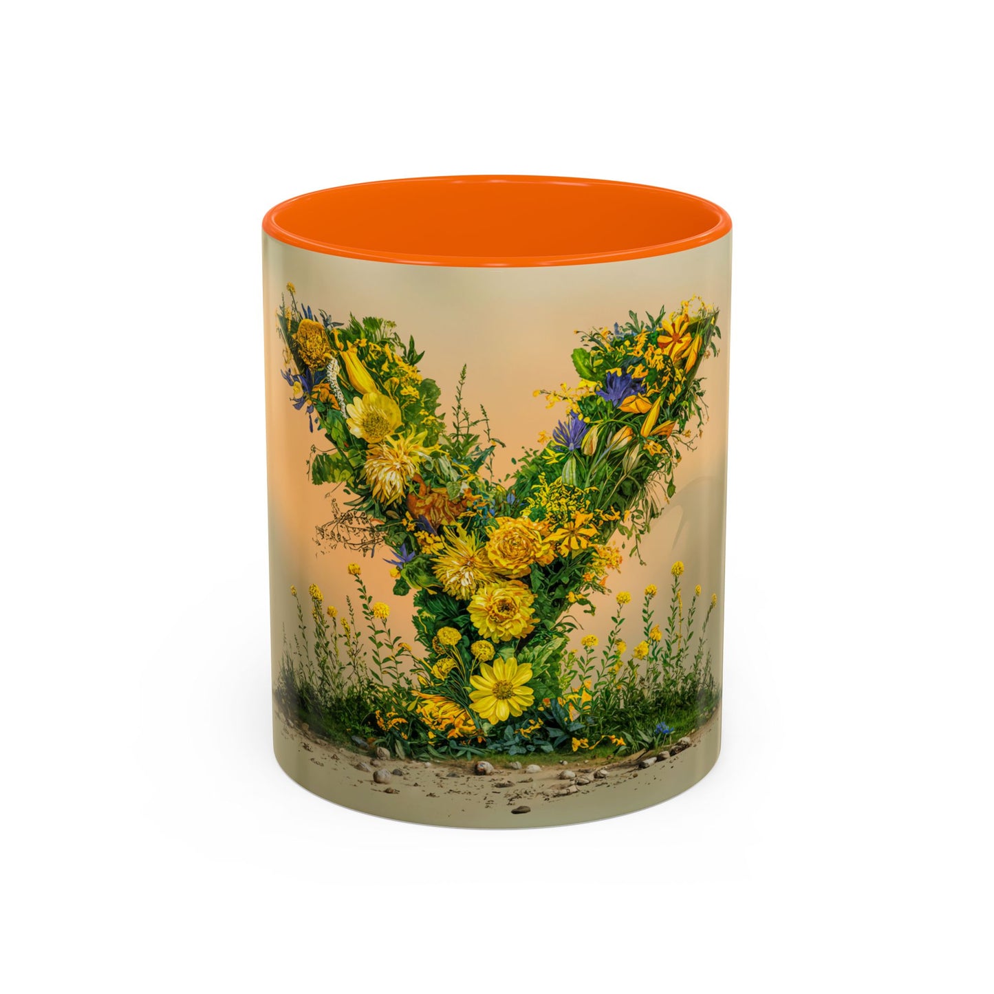 Mug with floral design and orange interior on a white background