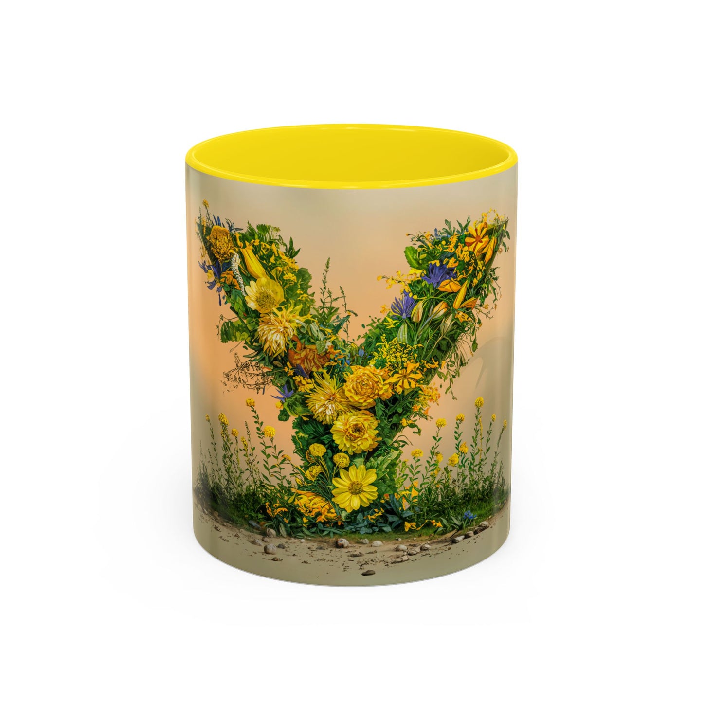 Mug with floral design and yellow interior on a white background