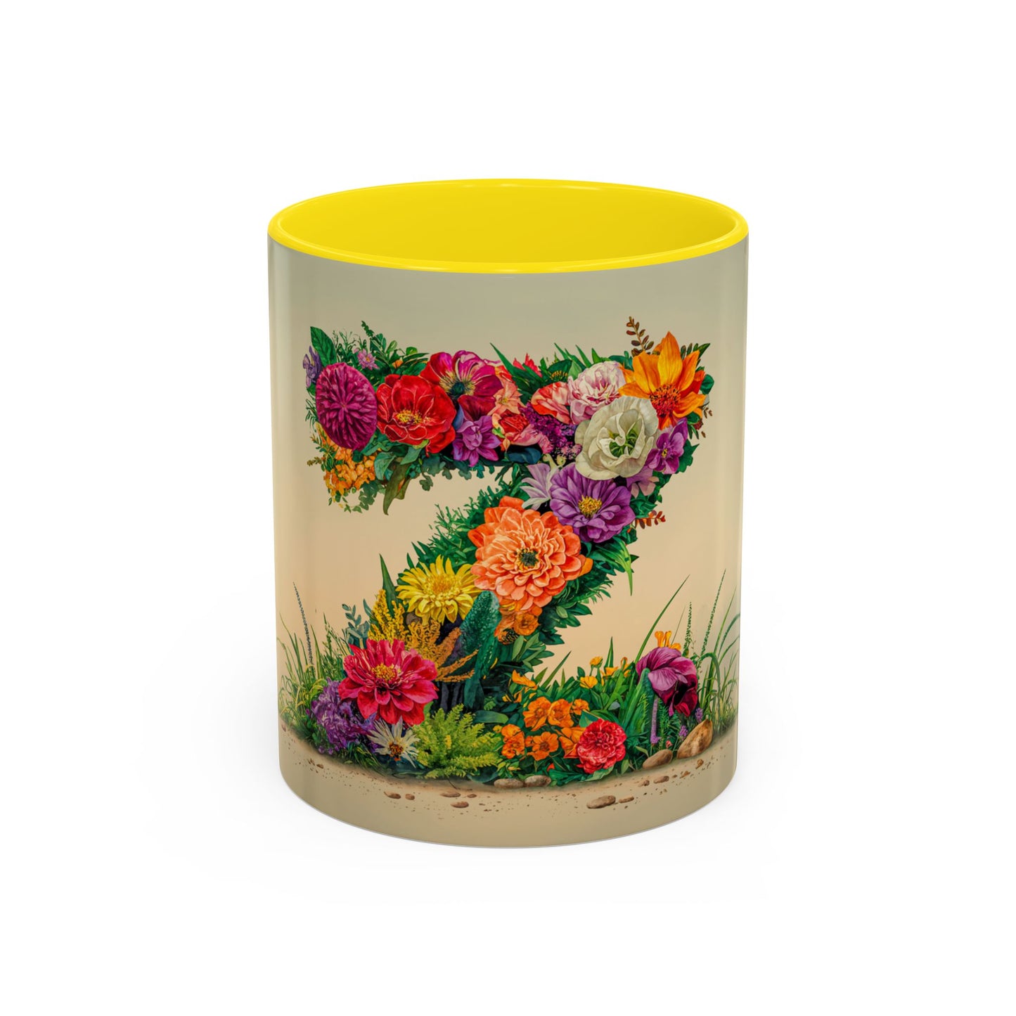 Mug with floral design and yellow interior on a white background