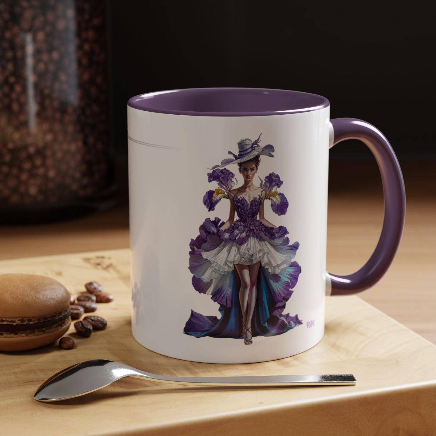 Mug with artistic design of a woman in a purple dress on a wooden surface with coffee beans and a spoon.