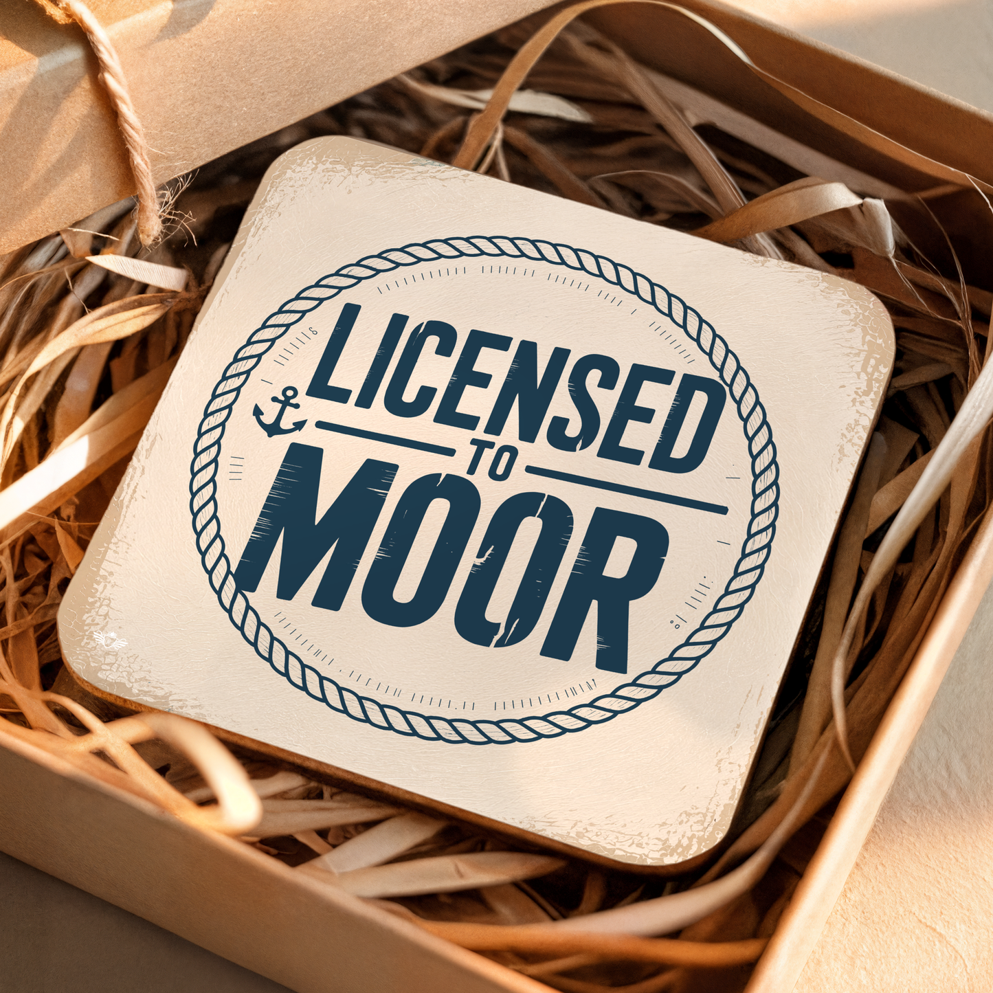Coaster with "Licensed to Moor" text in a box