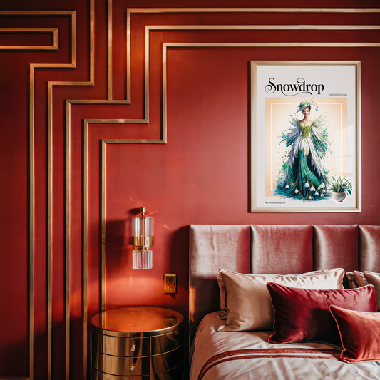 Decorative bedroom with red walls, a bed with pillows, and a framed picture on the wall.