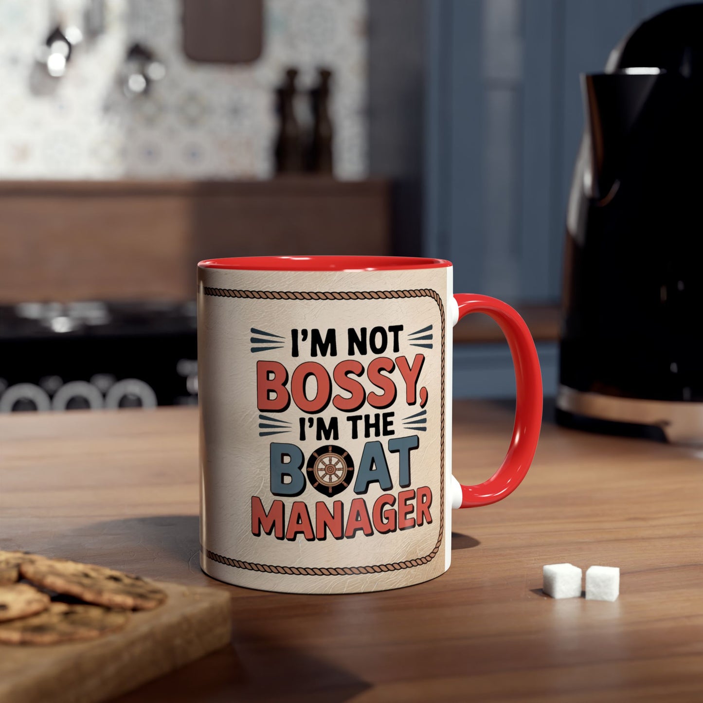 Mug with "I'm not bossy, I'm the boat manager" text on a kitchen counter.