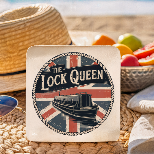 Coaster with "The Lock Queen" design featuring a boat and British flag on a woven surface with fruit in the background.