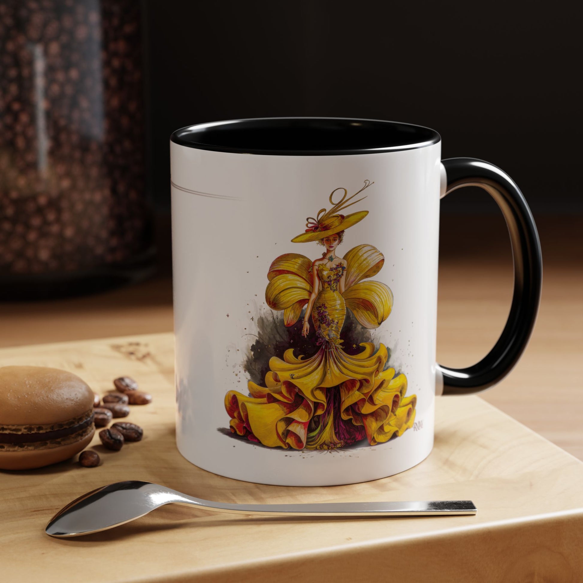 Mug with a decorative design on a wooden surface with coffee beans and a spoon.