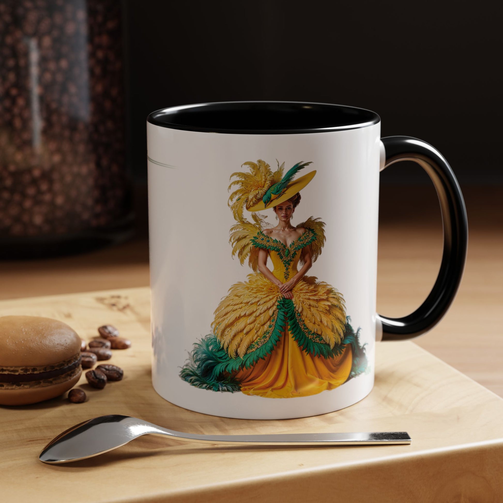 Mug with a decorative design of a woman in a yellow dress on a wooden surface with coffee beans and a spoon.