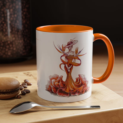 Mug with artistic design on a wooden surface with coffee beans and a spoon.