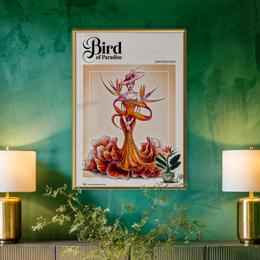 Framed artwork titled 'Bird of Paradise' on a green wall with two lamps and a plant.