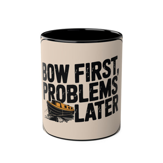 Beige mug with black interior, text "Bow First, Problems Later", and small graphic of a boat on a beige background.