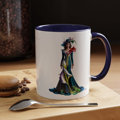 Mug with a colorful dress design on a wooden surface with coffee beans and a spoon.