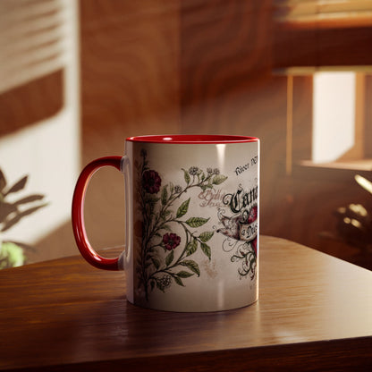 Mug with heart design and text on a wooden surface