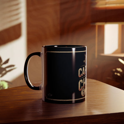 Black mug with text on a wooden surface