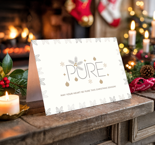 Christmas card with "PURE" text on a festive background with candles and stockings.