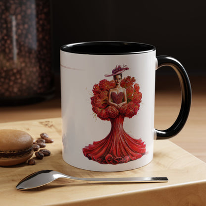 Mug with artistic design of a woman in a red dress on a wooden surface with coffee beans and a spoon.