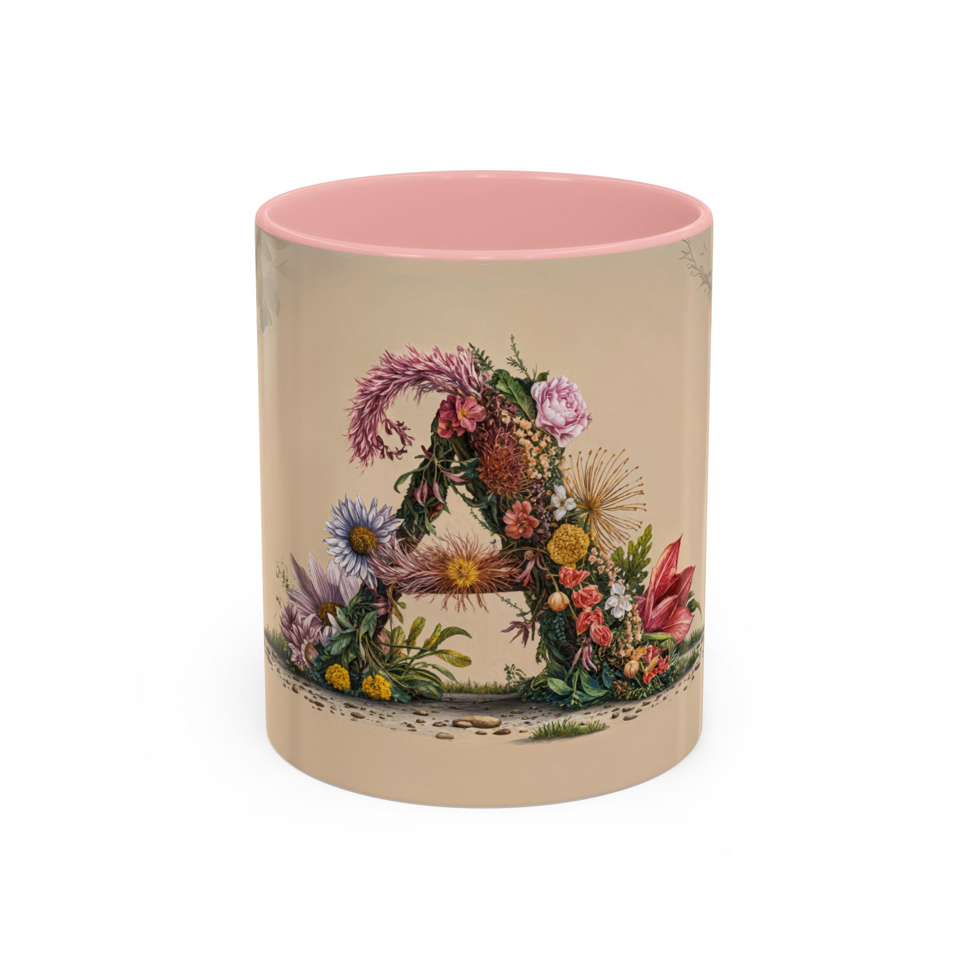 Ceramic mug with floral design and pink interior on a beige background